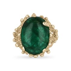 Embrace the unique allure of nature with our Solitaire Cabochon Cut Gold Nugget Ring. Featuring a mesmerizing 12-carat oval cabochon cut emerald with a deep green hue and translucent clarity, this piece captures the essence of earth's beauty. Set vertically in a distinctive gold nugget/ruffle styled prong setting crafted from 14k yellow gold, this ring merges organic elegance with luxurious craftsmanship, creating a statement piece that exudes both sophistication and raw natural charm. Setting Style: Prong-Solitaire Setting Material: 14K Yellow Gold Setting Weight: 7.0 Grams Main Stone: Emerald Cut: Cabochon Shape: Oval Weight: 12-Carats Clarity: Translucent  Color: Dark Green Luster: Very Good Treatments: Natural, Oiling Origin: Zambia Estimated Retail Value: $9,700.00 USD A certificate o Gold Nugget Ring, Birthday Gift Ring, Emerald Ring Gold, Emerald Earrings Studs, Gold Nugget, Ruffles Fashion, Birthday Ring, Colombian Emeralds, Cabochon Ring