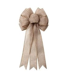 a beige ribbon with a large bow on the front and back of it's head