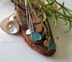 Give that special person in your life a personalized one-of-a-kind necklace this unique teal blue sea glass pendant. Choose from a silver or gold initial charm and matching chain. Pick the letter you want imprinted on the charm to make this a unique gift. The necklace is genuine ocean tumbled sea glass found by me from the beaches of Maryland, Delaware, or Puerto Rico. The pendant comes wrapped, ready to gift, or treat yourself.  Details *Teal Blue Sea Glass, approximately 1/2 of an inch tall & 1/2 of an inch wide *Choose Stainless Steel Silver Plated Chain or Gold Plated Chain *18 Inch Chain with a 2 inch extender *4 centimeter round silver or gold plated initial charm Check out my other personalize sea glass necklaces by clicking on this link: https://www.etsy.com/shop/ChesapeakeSeaglass Seaglass Beach, Engraved Pendant, Sea Glass Pendant, Blue Sea Glass, Sea Glass Necklace, Gold Initial, Sea Glass Jewelry, Initial Charm, Jewelry Silver