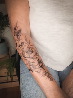 a person with a flower tattoo on their arm