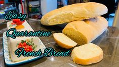 two loaves of bread sitting on top of a counter next to a loaf of bread