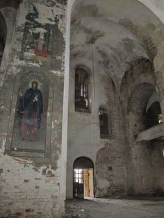 an old building with paintings on the walls