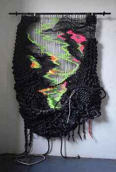 a wall hanging made out of woven material