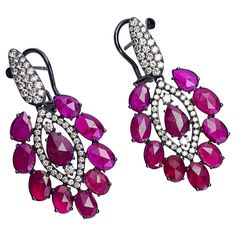 These drop earrings from Sutra are composed of 12.25 carats of marquise, oval and pear shaped rubies and 1.48 carats of round brilliant diamonds. Set in 18-karat blackened white gold. The earrings measure 1.75" long x .75" wide and have a post/clip back. Stamped Sutra Available at Cellini Jewelers NYC Ruby Earrings, Editing Service, Diamond Drops, Lovely Jewellery, Diamond Drop Earrings, Brilliant Diamond, Round Earrings, Pear Shaped, Round Brilliant