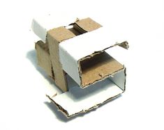 an open cardboard box sitting on top of a white surface