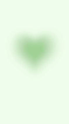 a heart shaped object on a green background