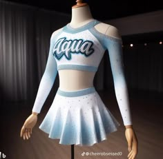 a white and blue cheer uniform on display