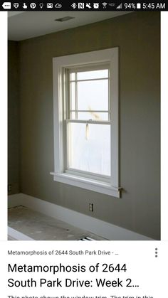 an image of a window in the middle of a room that is being painted gray