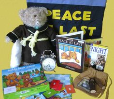 a teddy bear sitting on top of a table next to books and an alarm clock