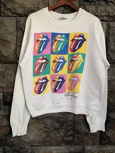 "Vintage 80s Rolling Stones Under License to Brockum Sweatshirt Item Condition: Pre-Owned (Used) condition. please see pictures Size on Tag: L, Please check measurement Tag : fruit of the loom ------------ Measurement: ------------- Chest (Pit to Pit) 21.5\" Length 24\" Sleeve 23.5\" Shipping: Worldwide ---------- Standard Shipping 14-30 Days Express 5-8 Days I can do combined shipping" Retro Multicolor Graphic Print Sweatshirt, Vintage Multicolor Cotton Sweatshirt, Bowie Tshirt, Beatles Sweatshirt, 1980s Sweatshirt, The Rolling Stones Shirts, The Rolling Stones Shirt, Rolling Stones Shirt, Harley Davidson Shirt