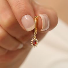 Garnet Stone; The representative of passion, true friendship, loyalty, success and consistency. Our oval cut garnet dangling earrings surrounded by real diamonds are a piece of jewelry that you can wear on daily and special occasions with their minimalist design. It is a nice gift for yourself and your loved ones. Be stylish and eye-catching with our earrings. The birthstone of those born in January is garnet. 🔸🔸 Our elegant, style and stylish products suitable for special occasions and daily Single Ruby Earring As A Gift, 14k Gold Marquise Earrings For Gift, Marquise Garnet Jewelry For Gift, Garnet Drop Earrings For Anniversary, Small Drop Earrings, Garnet Necklace, January Birthstone, True Friendship, Garnet Stone