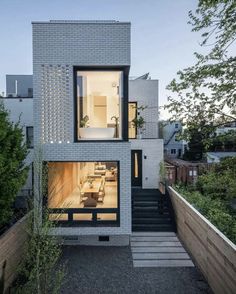 a modern house with stairs leading up to it