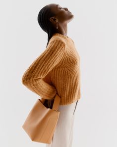 A modern and feminine take on the timeless crewneck sweater, knitted in an airy and lofty cable knit pattern from a soft blend of baby alpaca and virgin wool. Cable Knit Pattern, Knit Pattern, Baby Alpaca, Alpaca Wool, Crewneck Sweater, Knit Patterns, Black Sweaters, Crew Neck Sweater, Cable Knit