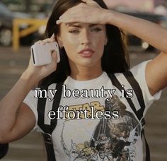 a woman holding a cell phone up to her face with the caption, my beauty is effortless