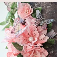 some pink flowers and butterflies on top of a tree trunk with text overlay that reads, wafer paper flowers and leaves