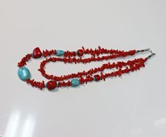 One of a kind, hand made, double strand necklace is perfect for you.  The necklace is made from red branch coral, red chunk coral and turquoise stones.  There are sterling silver beads at the end of the necklace.  This necklace will highlight you and your outfit as you display it at your next event or social gathering.  You will not see another necklace exactly like this necklace anywhere.  The necklace has four (4) chunks of red coral and three (3) turquoise stones.  The majority of the necklac Handmade Double Strand Turquoise Necklace For Gift, Handmade Multi-strand Red Coral Jewelry, Handmade Multi-strand Red Coral Necklace, Bohemian Red Turquoise Single Strand Necklace, Handmade Red Artisan Turquoise Necklace, Handmade Red Turquoise Necklace For Jewelry Making, Handmade Double Strand Southwestern Necklace, Red Coral Double Strand Necklace, Double Strand Red Coral Necklace