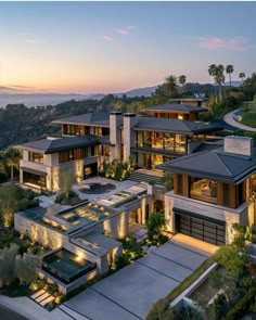 an aerial view of a modern home at dusk