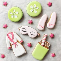 decorated cookies are arranged on a table