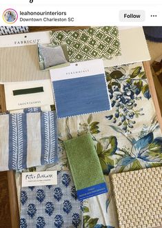 an assortment of fabric samples displayed on a table