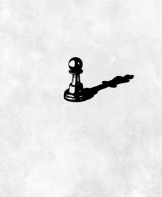 a black and white photo of a faucet with shadow on the wall behind it