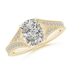 a yellow gold engagement ring with a cushion cut diamond in the center and side stones