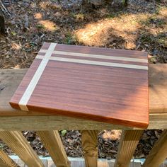 a wooden bench sitting on top of a forest