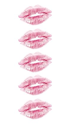 three pink lipstick kisses on a white background