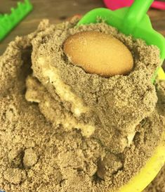 a bowl filled with sand and a spoon