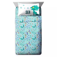 the sea bedding is made with blue and green fish