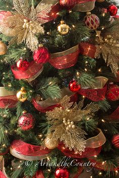 a christmas tree decorated with red and gold ornaments