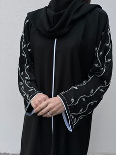 Elegant Long Abaya With Dabka Work, Long Abaya With Dabka Work, Formal Abaya With Dabka Work For Eid, Formal Eid Abaya With Dabka Work, Traditional Embroidered Long Sleeve Khimar, Traditional Long Sleeve Embroidered Khimar, Traditional Long Khimar For Wedding, Eid Long Abaya With Intricate Embroidery, Wedding Abaya With Dabka Work And Long Sleeves