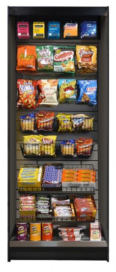 a display case filled with lots of food and snacks on it's sides in front of a white wall