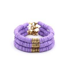 A purple and gold heishi bead bracelet is the perfect on-trend accessory to top off your look. It is a great stand alone bracelet and works well as a stack bracelet, too. This non-stretch bracelet features purple polymer clay heishi beads with gold brushed metal beads in the center, all hand-strung onto flexible jewelry wire. The bracelet is finished off with a lobster clasp, and a 1" extender chain to accommodate various wrist sizes. MATERIALS Polymer Clay & Metal Beads SIZE 6 1/2" Extendable U Adjustable Purple Heishi Beads Bracelets, Purple Polymer Clay, Heishi Bead Bracelet, Bracelet Inspo, Stack Bracelet, Clay Bracelet, Jewelry Wire, Heishi Beads, Brushed Metal