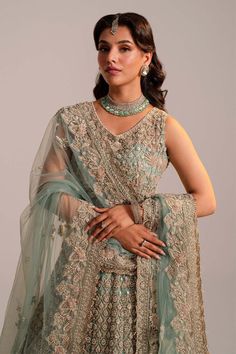 Pakistani Bridal Dress in Turquoise Lehenga Choli Style is embellished with zardosi, embroidery, sequins, motifs, and shimmering ornaments. Premium net fabric and perfect stitching make this Bridal Lehenga Choli an epitome of beauty and grace. Detailed Description: SKU: BS2483 Detailing: Embroidery, Motifs, Naqshi, Sequins, Dabka, Gota, Kora, Threads Color: Turquoise Blue Fabric: Organza, Net Design: Fully Embellished Dress with Embroidery Event: Bridal wear, Wedding Turquoise Lehenga, Blue Bridal Lehenga, Choli Style, Bridal Lehenga Pakistani, Pakistani Bridal Lehenga, Pakistani Bridal Dress, Dupatta Style, Zardosi Embroidery, Net Design