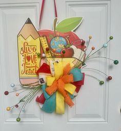 a door hanger decorated with school supplies