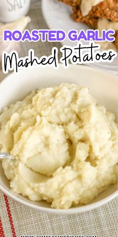 mashed potatoes in a white bowl with text overlay reading roasted garlic mashed potatoes