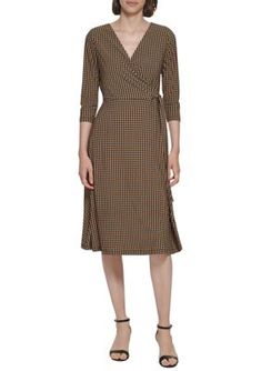 The wrapped silhouette of this Tommy Hilfiger dress flatters any figure while a classic houndstooth print adds immeasurable charm. | Tommy Hilfiger Women's 3/4 Sleeve Tie Waist Printed Wrap Dress, 10 Fitted Wrap Dress With 3/4 Sleeves For Spring, Fitted Wrap Dress For Office In Fall, Knee-length Wrap Dress For Fall Workwear, Fitted Houndstooth Midi Dress For Fall, Fitted Midi Dress With Houndstooth Pattern For Fall, Houndstooth Midi Dress For Work, Elegant Houndstooth Midi Dress For Spring, Elegant Spring Midi Dress With Houndstooth Pattern, Elegant Midi Dress With Houndstooth Pattern For Spring