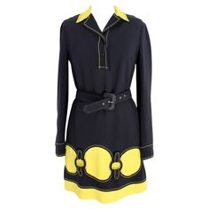 Moschino vintage 90s yellow and black dress. Short sheath dress with collar, black with yellow profiles, belt at the waist. Button closure and side zip. 52% rayon, 48% acetate fabric, internally lined. Made in Italy. Size: 42 It 8 Us 10 Uk Shoulder: 42 cm Bust / Chest: 46 cm Sleeve: 61 cm Waist: 43 cm Length: 93 cm Moschino Runway 90s, Moschino Cheap And Chic 90s, Moschino Vintage 1990s, Moschino Flower Dress, Short Sheath Dress, Moschino Cheap And Chic, 90s Dress, Yellow Black, Collar Dress