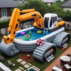 an inflatable pool with a construction vehicle on it