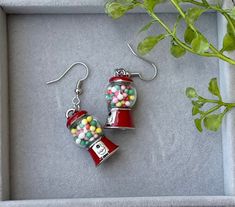 "Candy Novelty Bubblegum Machine Earrings, Dangling Food Bubble Gum Jewelry, Dangle Candy Food Earrings, Drop Red Colorful Food Earrings, Mother's Day Gift, Gift for Her These red, colorful, Candy Bubblegum novelty earrings would make a perfect gift for girls, mothers, grandmothers, or a friend. Perfect for the candy and foodie in your life! This multicolored bubblegum machine charm is embellished with eye-catching beads and has rhodium finishing. This fun, novelty, food charm is made of zinc alloy, plastic, enamel, glass, and iron and is approximately 0.5\" wide and drops about 2 inches. Would make a great birthday or Mother's Day gift! To make sure you are receiving notifications of my new creations, don't forget to favorite my shop! Click below to shop in my unique boutique: http://cre8 Multicolor Novelty Earrings, Retro Hypoallergenic Earrings For Gift, Novelty Multicolor Earrings For Birthday, Novelty Multicolor Earrings With Ear Wire, Whimsical Multicolor Earrings For Gift, Whimsical Multicolor Earrings As Gift, Bubblegum Machine, Candy Fashion, Crazy Earrings