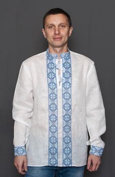 "Embroidered shirt \"Panska\" Embroidered men's shirt \"Panska\", 100% linen, white, black colour. Band-collar, long sleeves, embroidered cuff. Shirt with a traditional Ukrainian embroidery same-tone with the main colour. The pattern includes rhombs, dotty rhomb, crossed rhombs. The figure of rhomb is very widespread in protective ethnic symbolics. It means fertility and productiveness. Most commonly dotty rhomb symbolizes sown field. The figure of square is also a symbol of earth. An eight poin Traditional White Linen Shirt, Traditional Embroidered Linen Shirt, White On White Embroidery, Embroidery Blue, Ukrainian Clothing, Mexican Shirts, Mexican Outfit, White On White, Ethnic Patterns