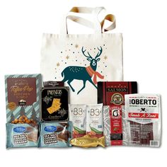 a shopping bag filled with different types of food and snacks, including chocolates, candy bars, candies, nuts, and more