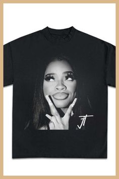 a black t - shirt with an image of a woman's face on it