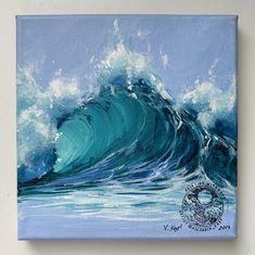 a painting of a large wave in the ocean on a blue canvas with white paint