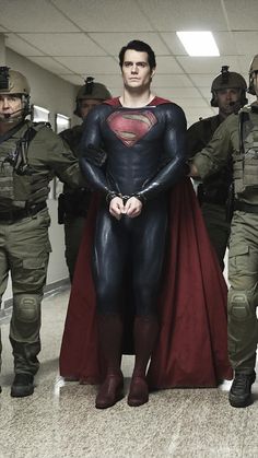 the man in superman costume is surrounded by soldiers