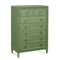 a green dresser with many drawers and knobs