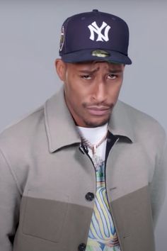 a man wearing a new york yankees baseball cap