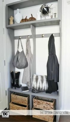 the closet is organized with baskets and bags