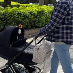 a man walking down the street with a stroller