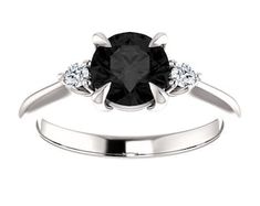 Elegant Black Diamond Ring With Accent Stones, Black Diamond Ring With Accent Stones, Classic Black Rings With Accent Stones, Formal Black Round Cut Rings, Black Diamond Rings With Accent Stones, Fine Jewelry Black Solitaire Ring, Black Round Cut Ring With Center Stone, Black Solitaire Ring Fine Jewelry, Black Solitaire Diamond Ring With Round Cut